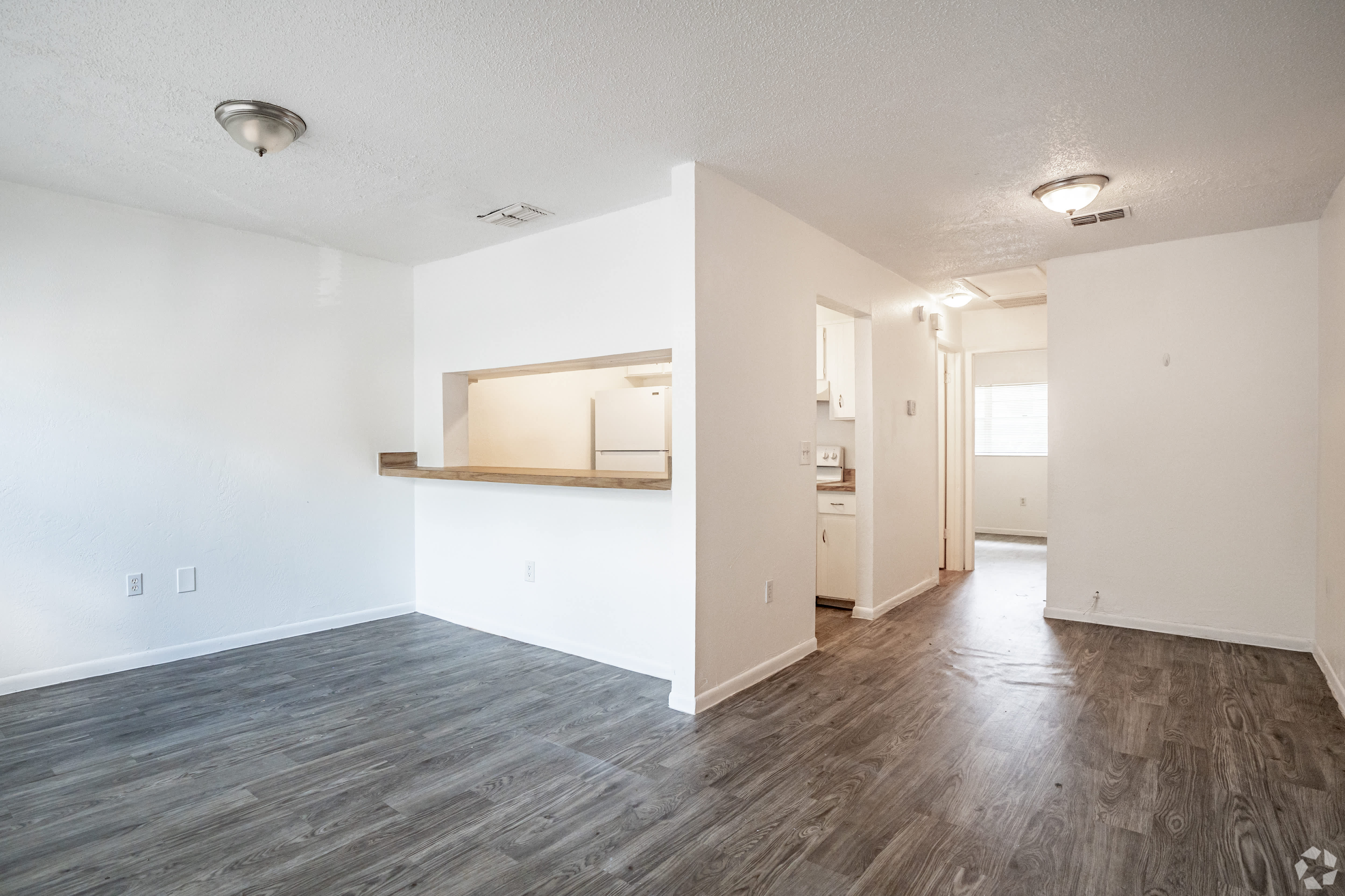 Open living area with vinyl plank flooring